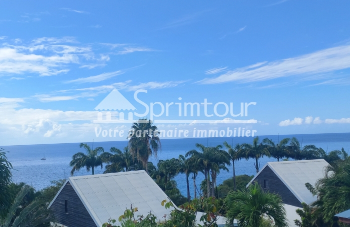 Exceptionnel une maison 55 m2 à la vente à DESHAIES- Vue mer - Belle plage de sable fin à 150 m.